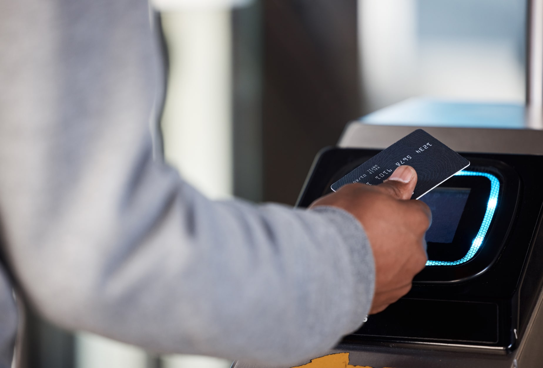 Person tapping their credit card