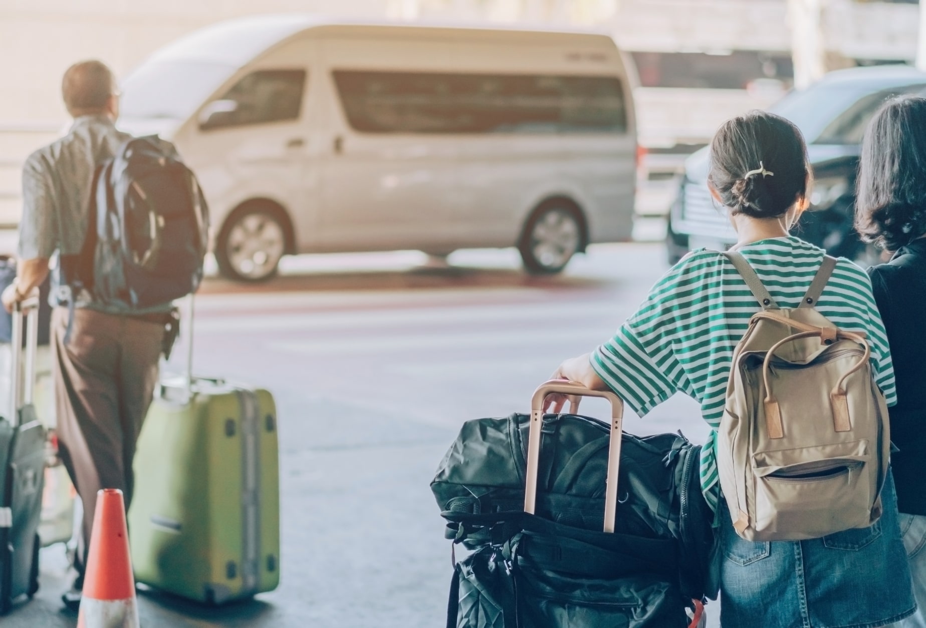 Tourists walking with their luggage and carriers