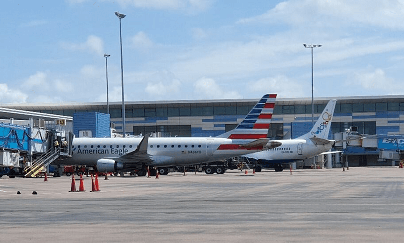 Airlines taxiing on the runway.
