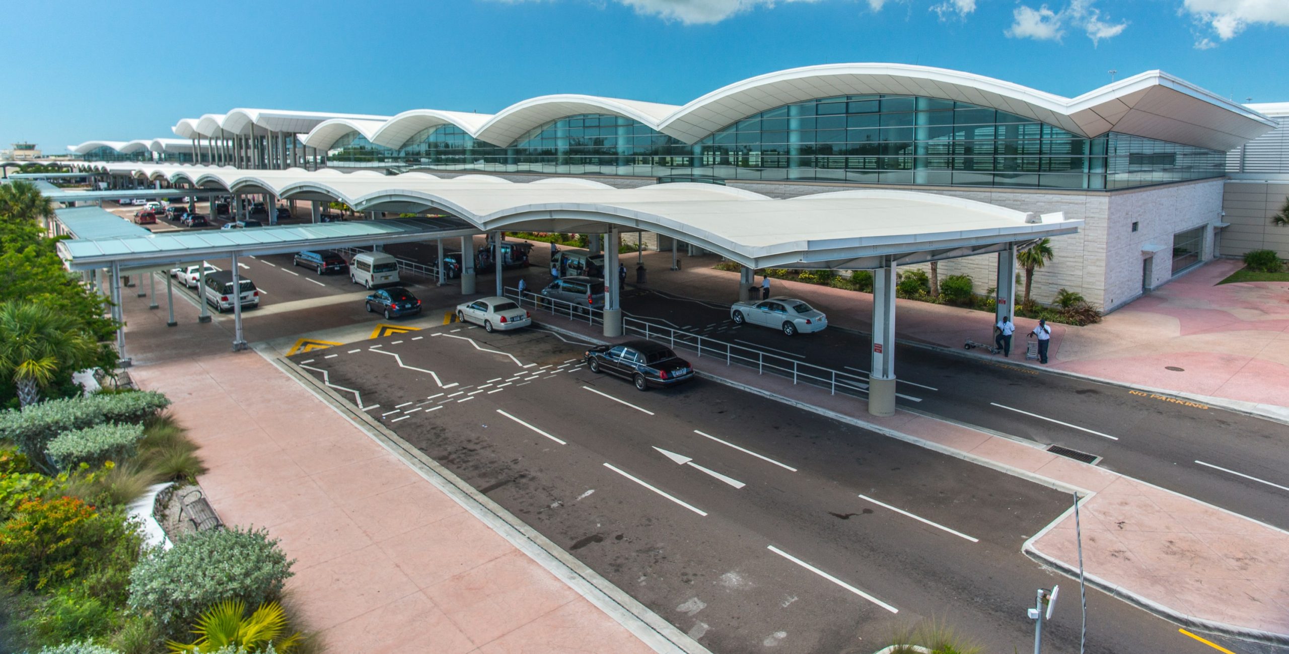 Cars by the airport entrance