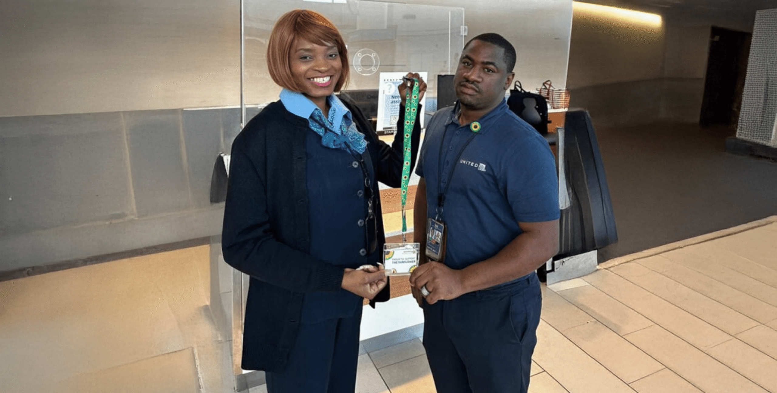 Two people chatting about the lanyard.